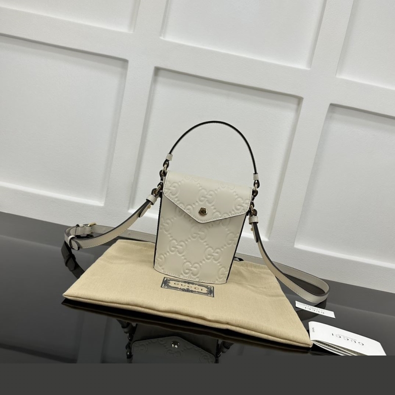 G*u*i top handle bags